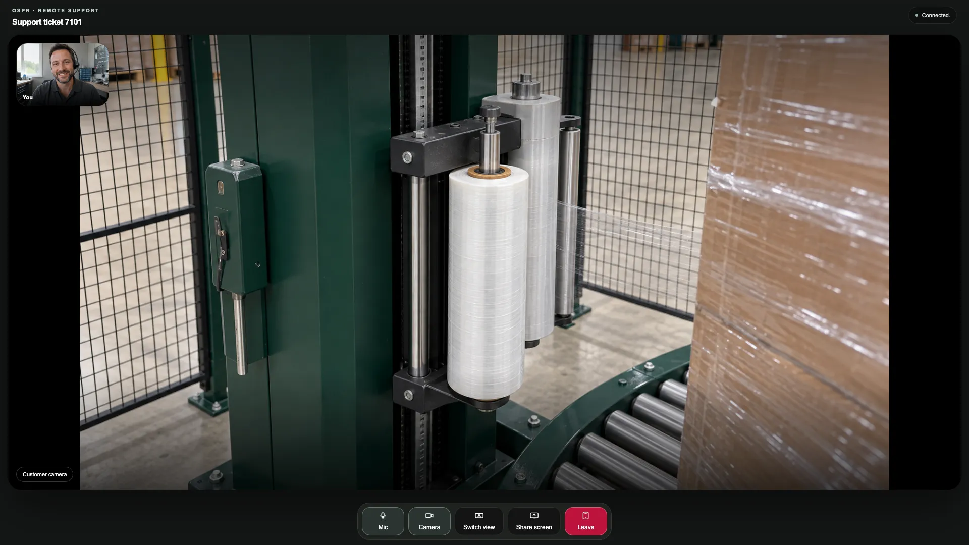 Provider technician’s desktop in support ticket 7101: the customer’s equipment camera fills the room, with the technician in the small self-view.